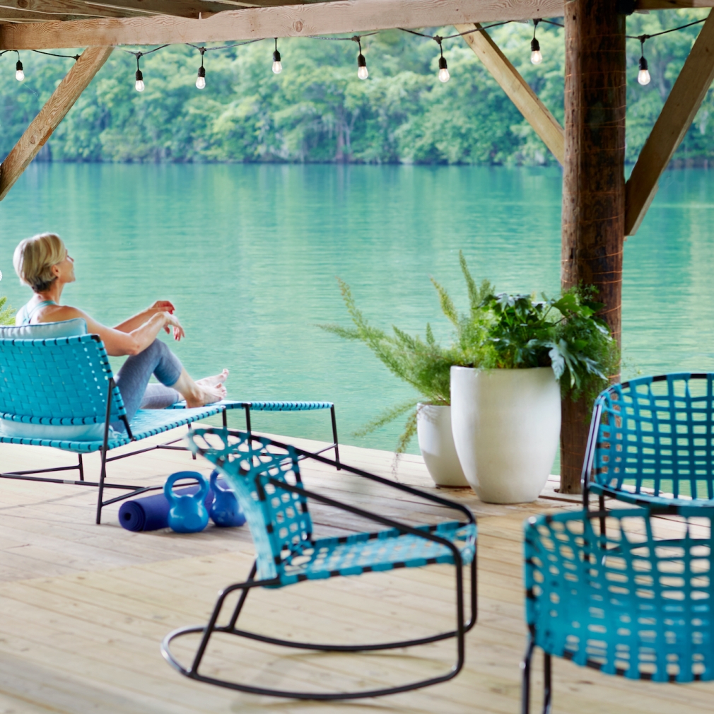 Woman relaxing at Lake Austin Spa overlooking the lake