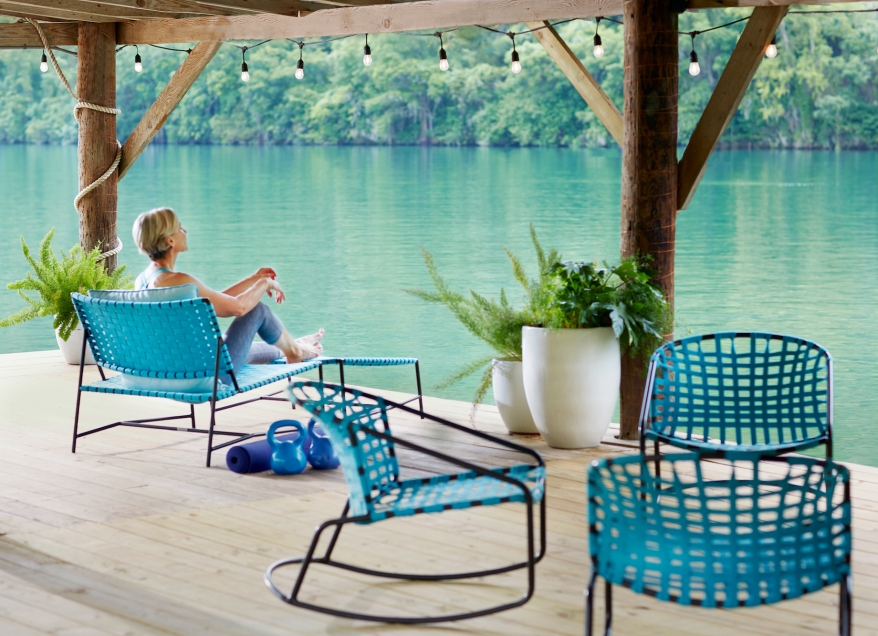 Woman relaxing at Lake Austin Spa overlooking the lake